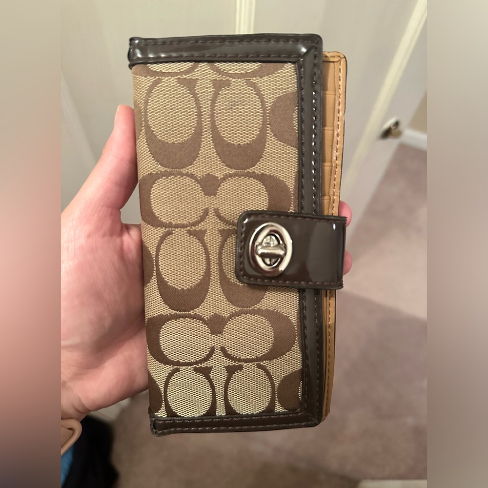 Coach brown wallet with twist lock detail